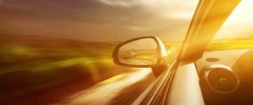  Car on the road with sun